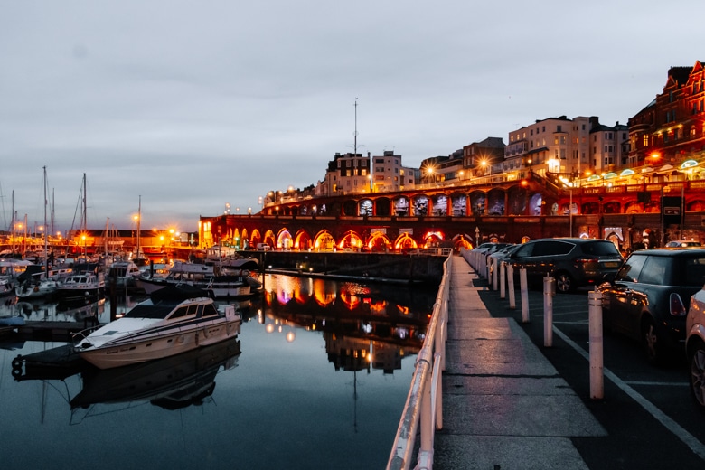 View of the Ramsgate Royal Harbour and buildings on the other side of the road at night - things to do in Thanet