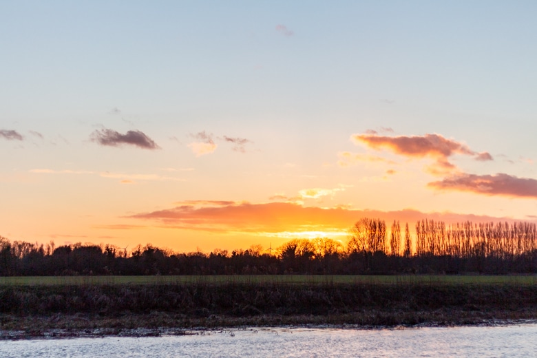 Sunset over the River Great Ouse, view from the Nobles Field in St Ives, Cambridgeshire