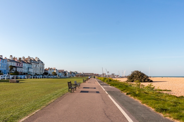 View of the path leading from Warmer to Deal with colourful buildings on the right - walk from Dover to Deal