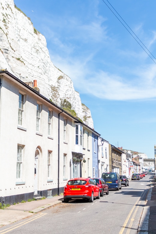 White Cliffs of Dover behind the row of houses - beginning of the walk from Dover to Deal