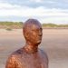 Crosby Beach, the nearest beach to Liverpool - close up of the sculpture, Another Place by Anthony Gormley (featured image)